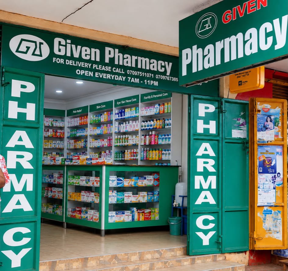 Given Pharmacy Highway (Jinja Mpya) branch entrance with prominent green signage and display of pharmacy inventory.